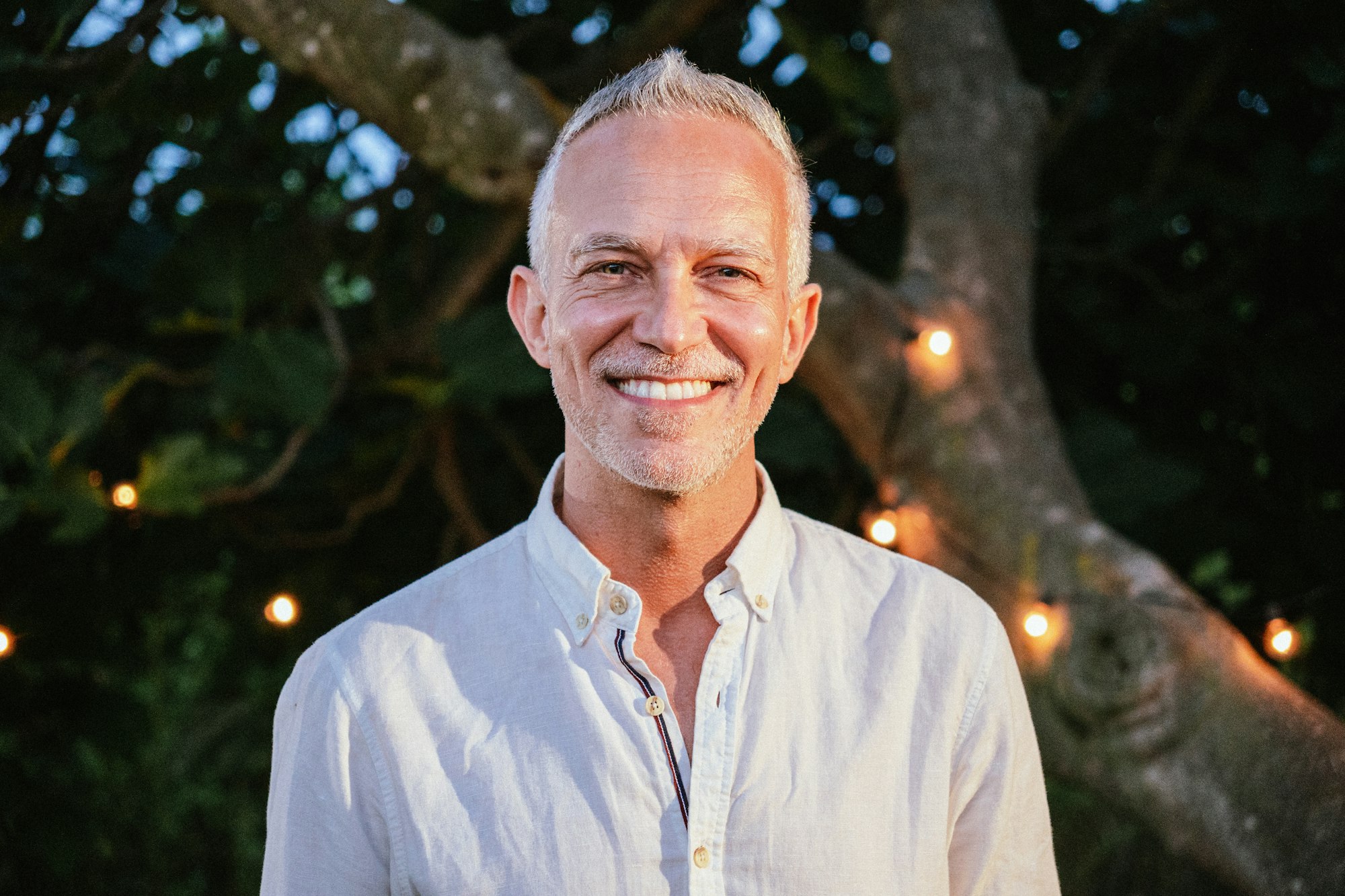 Close up ortrait of happy mature man with gray hair looking and smiling at camera Lifestyle concept.